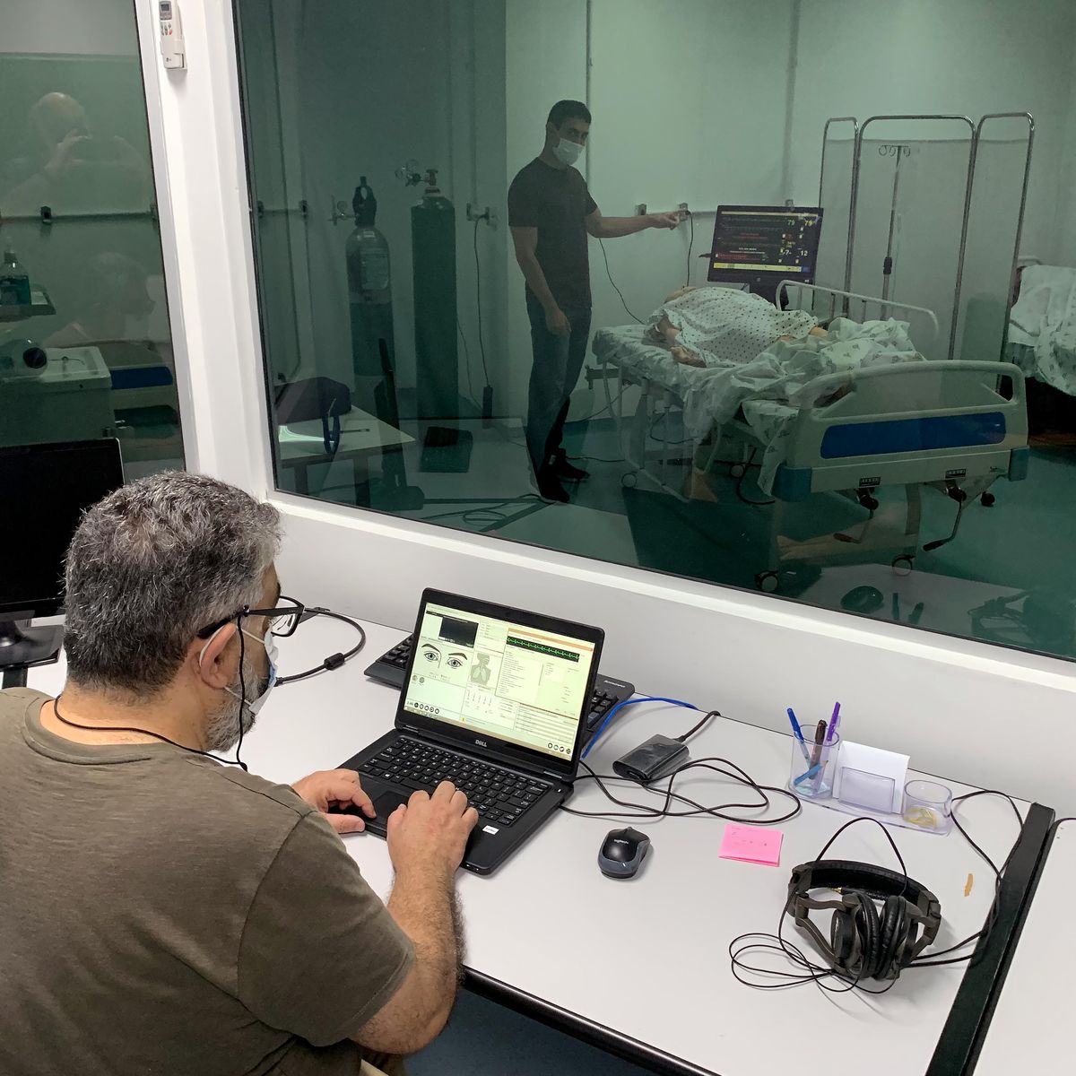 A researcher monitoring experiments in a lab setting