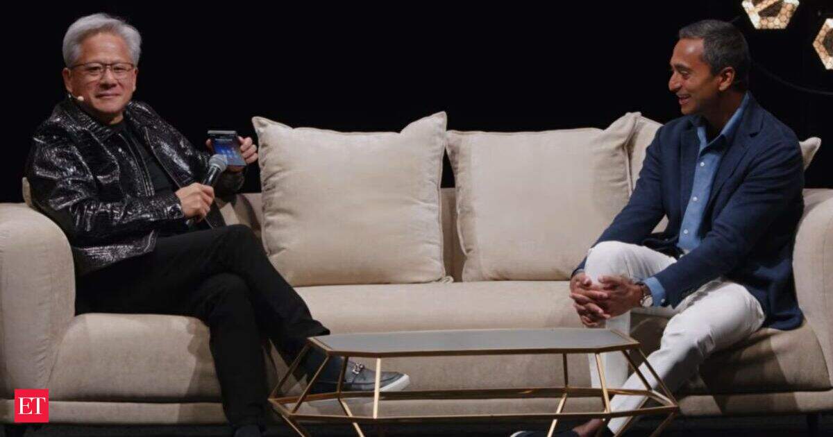 Hero image of the Economic Times article on Trump and Jensen Huang's live on-stage conversation about AI