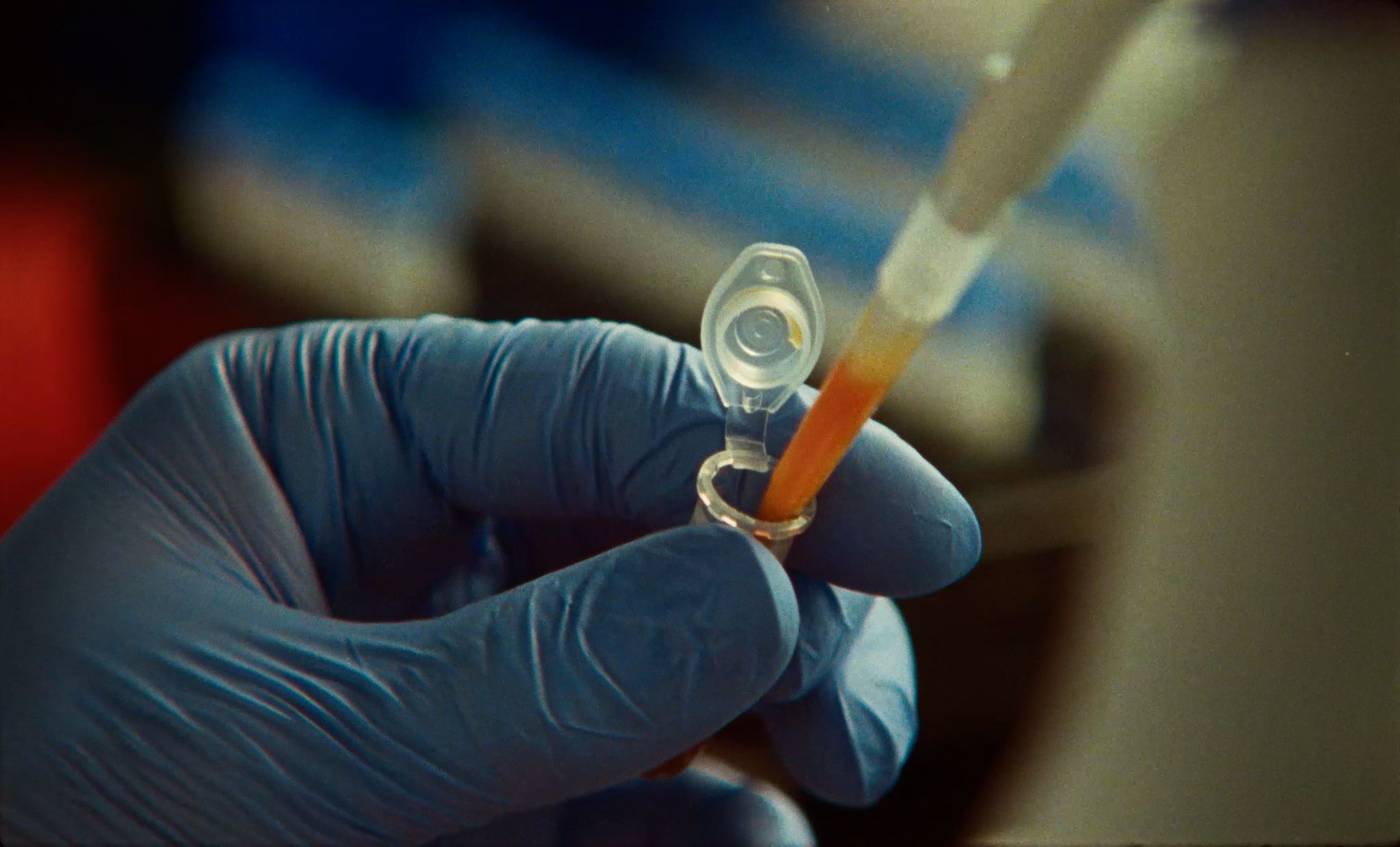 A scientist pipetting