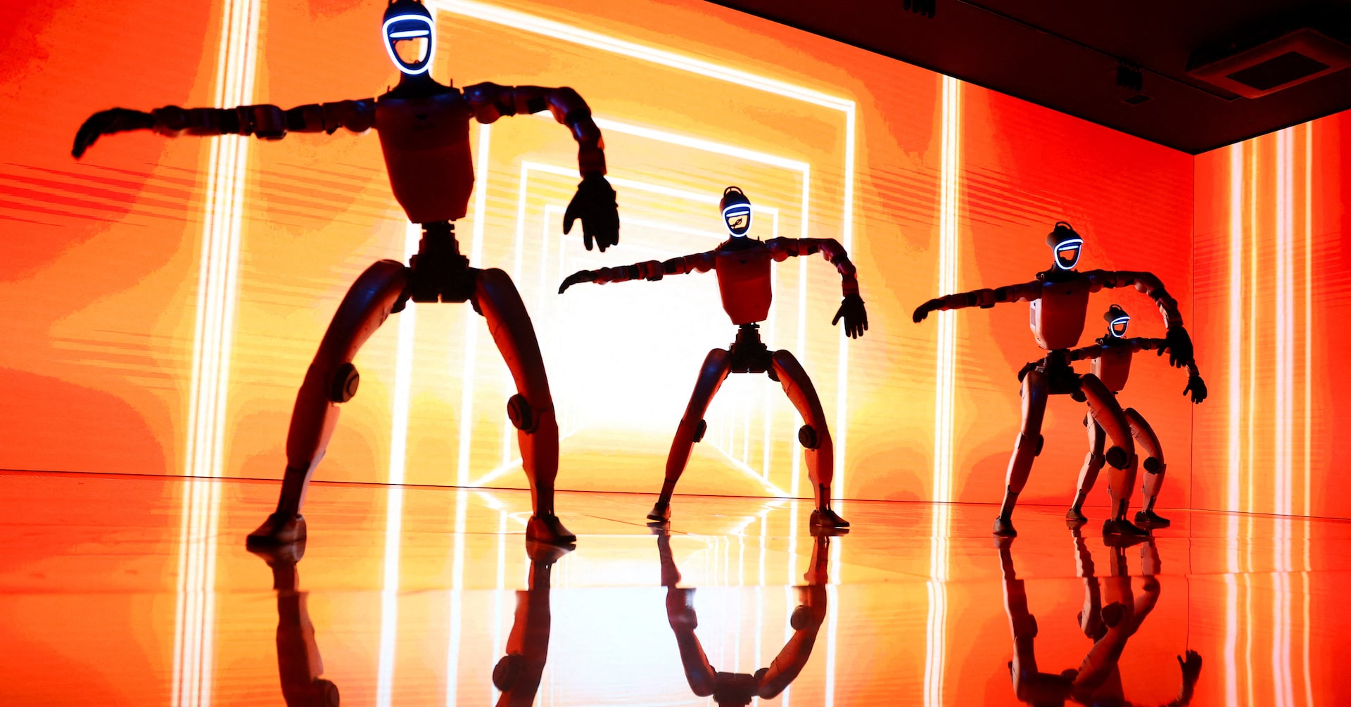 Unitree G1 Humanoid Robots dance during an unveiling event in Tokyo, September 8, 2026 (Reuters/Issei Kato, file photo)